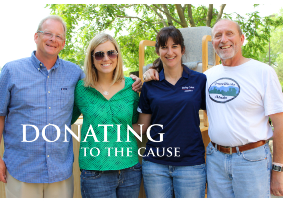 Four team members smiling- donating to the cause